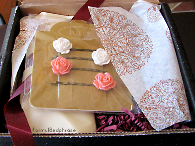 The May Julep box. The tissue is sparkly and has a pretty floral design.